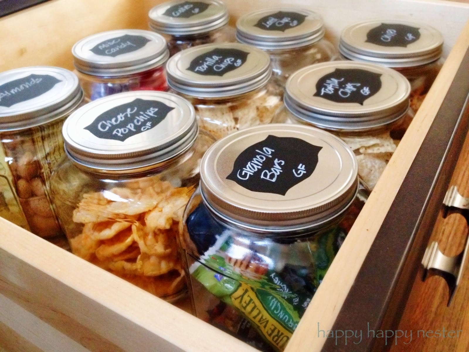 9 Tips For Kitchen Organization made easy. Follow these tried and true steps, your kitchen will be thoroughly organized. A well-organized kitchen is great. Place your snacks in big glass jars along with labels and your family will thanks you! #organizing