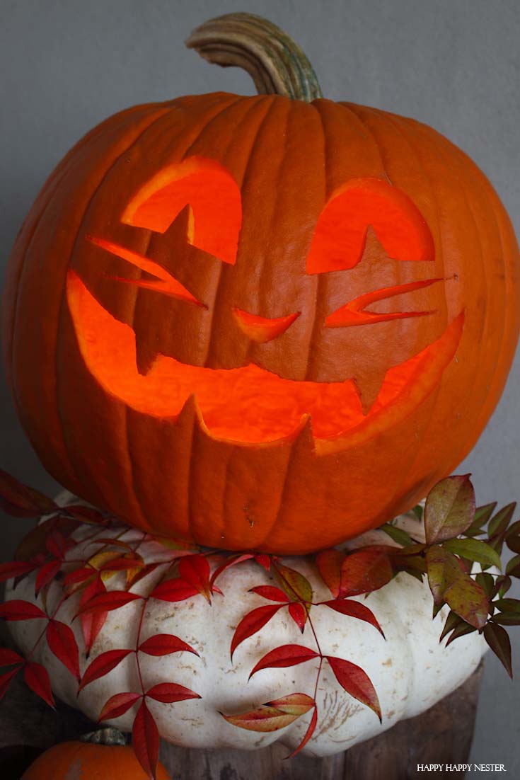 jack-o-lantern on white pumpkin