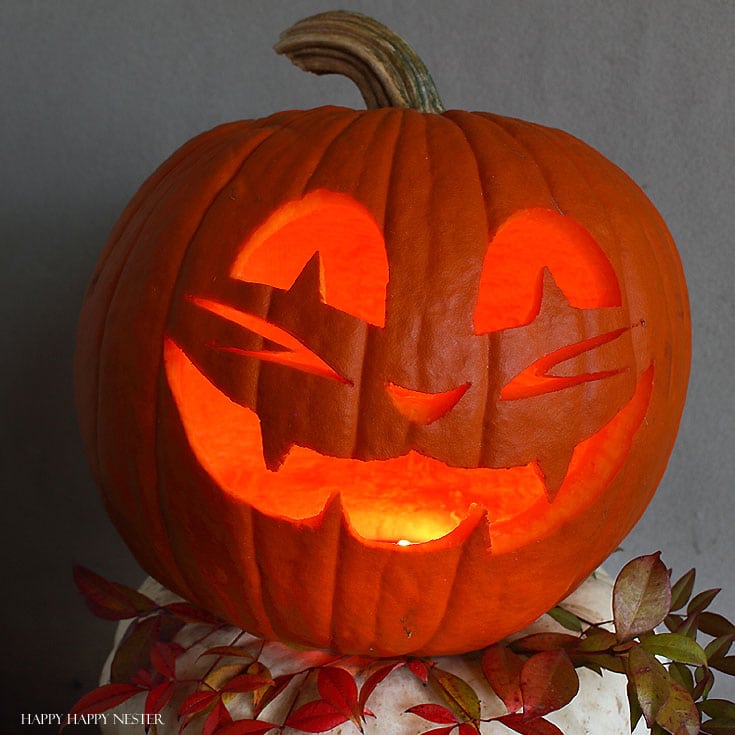 essential pumpkin carving tips and tricks - jack-o-lantern lit up with a candle