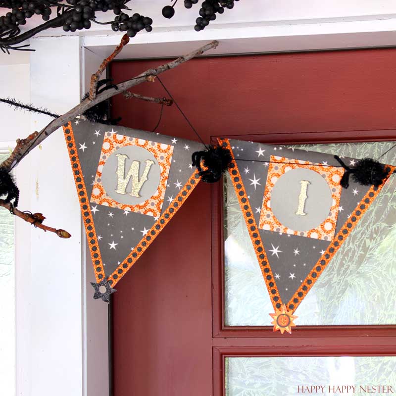 wicked garland hanging on a red door