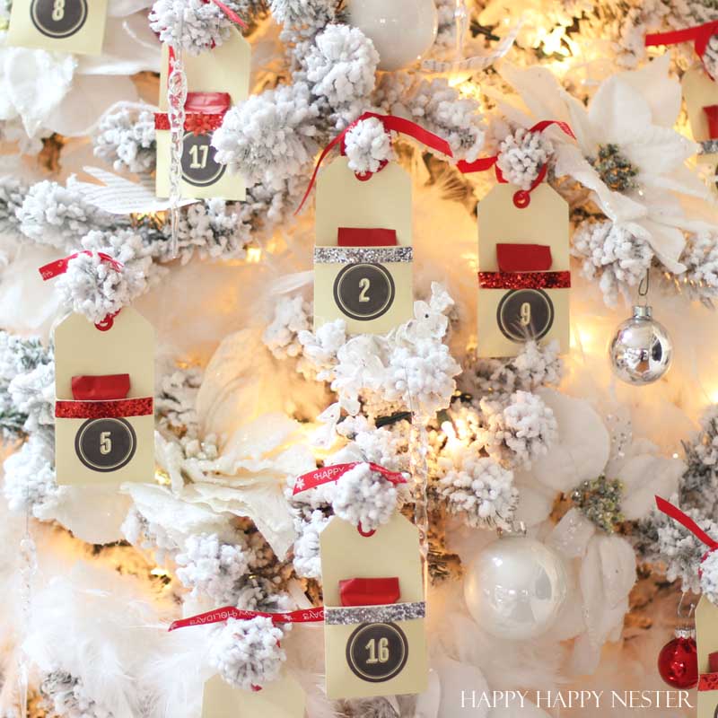 DIY Advent Tree uses your own Christmas tree. Place cute envelopes with numbers and fill with treats. This is the easiest advent tree you'll ever create!