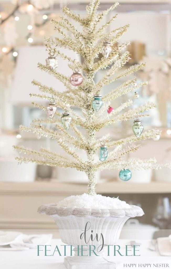 This is an easy way to make a Feather Tree. You take a tinsel tree and give it a good haircut. Then you add a bit of chalk paint to make it vintage like.