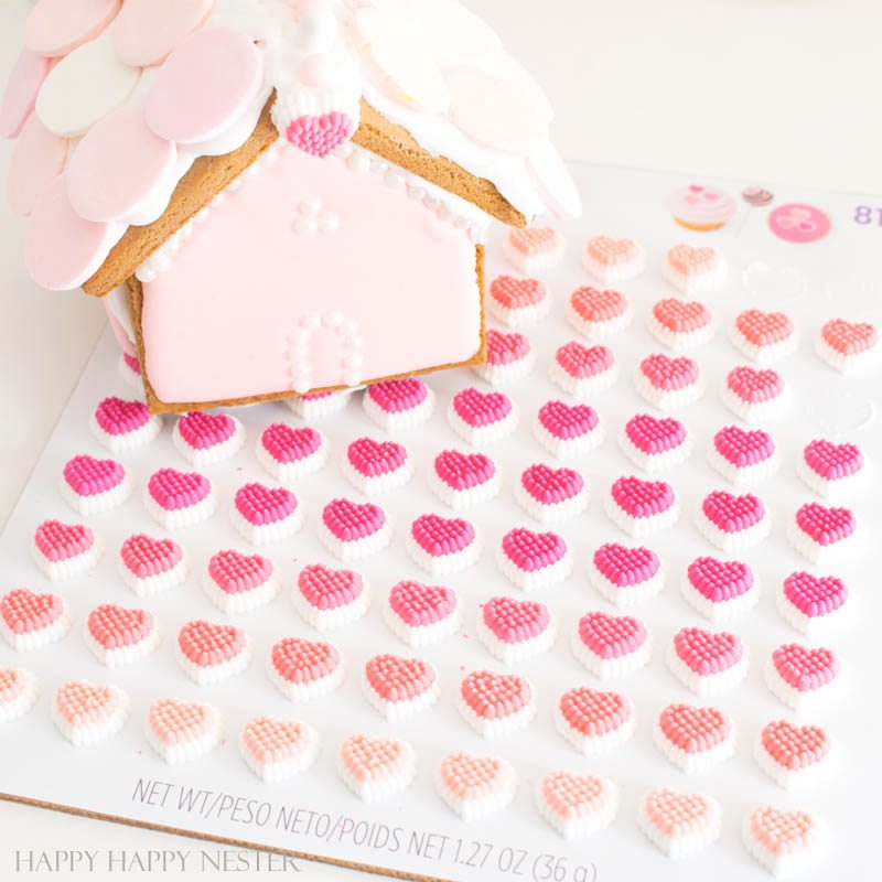 Need some gingerbread house ideas? This fun Valentine's Day Craft is so adorable. Make one or a few to create a village with this mini-gingerbread house kit. | Gingerbread House Kits | Perfect Icing | Gingerbread Tutorial | How to put together a gingerbread house | Gingerbread house themes | crafts | diy