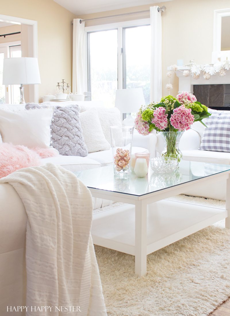 Decorating with pink is easy. Pink is getting a new look, and you should add some splashes in your home. I have two versions that introduce spring into my living room. I have some easy tips on quickly adding a few accents to your decor. Diy | decorating | blush | pink | millennials | trends