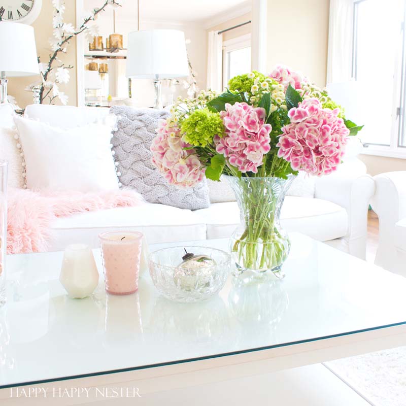 Decorating with pink is easy. Pink is getting a new look, and you should add some splashes in your home. I have two versions that introduce spring into my living room. I have some easy tips on quickly adding a few accents to your decor. Diy | decorating | blush | pink | millennials | trends