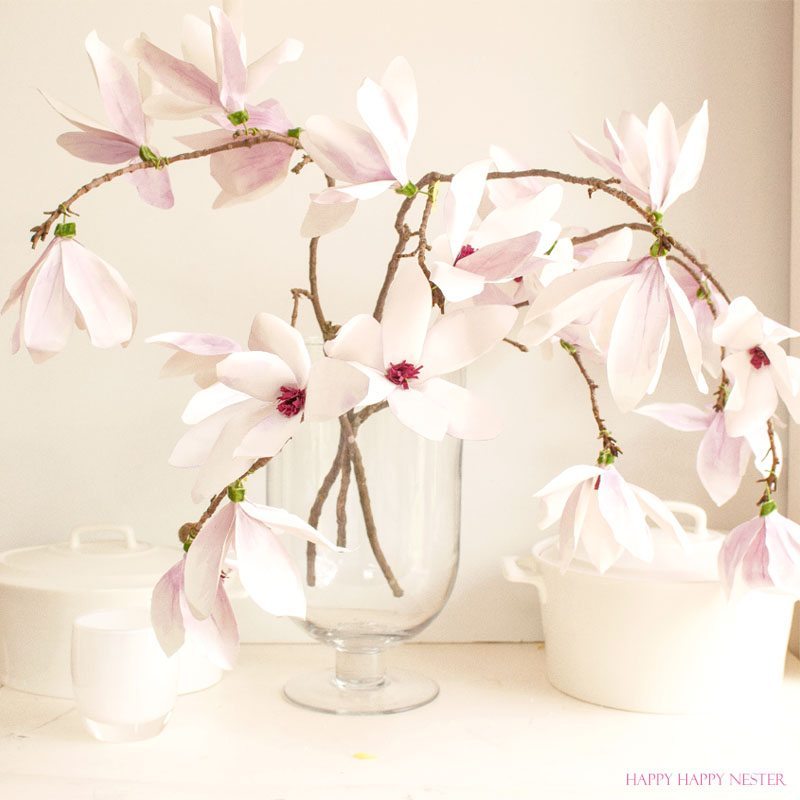 A magnolia paper flower tutorial you won't want to miss. I made this flower out of watercolor flower petals and added them to a tree branch, and you have lifelike flowers that you can make from paper. #DIY | #paperflowers | #crafts | #fauxflowers