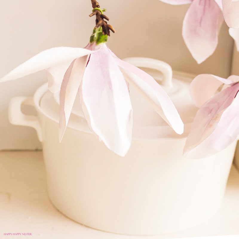 A magnolia paper flower tutorial you won't want to miss. I made this flower out of watercolor flower petals and added them to a tree branch, and you have lifelike flowers that you can make from paper. #DIY | #paperflowers | #crafts | #fauxflowers