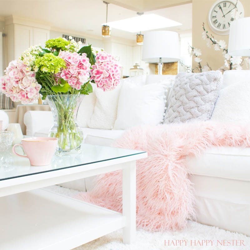 Decorating with pink is easy. Pink is getting a new look, and you should add some splashes in your home. I have two versions that introduce spring into my living room. I have some easy tips on quickly adding a few accents to your decor. Diy | decorating | blush | pink | millennials | trends