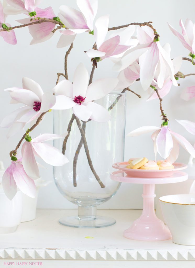 A magnolia paper flower tutorial you won't want to miss. I made this flower out of watercolor flower petals and added them to a tree branch, and you have lifelike flowers that you can make from paper. #DIY | #paperflowers | #crafts | #fauxflowers