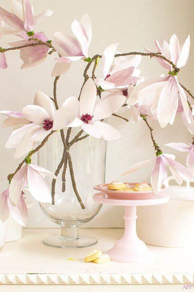 These magnolia flowers look so real. This paper flower tutorial you won't want to miss. I made this flower out of watercolor flower petals and added them to a tree branch, and you have lifelike flowers that you can make from paper. #DIY | #paperflowers | #crafts | #fauxflowers