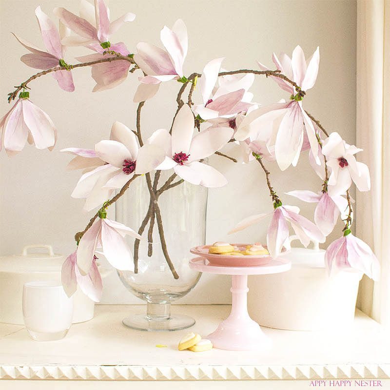 These magnolia flowers look so real. This paper flower tutorial you won't want to miss. I made this flower out of watercolor flower petals and added them to a tree branch, and you have lifelike flowers that you can make from paper. #DIY | #paperflowers | #crafts | #fauxflowers