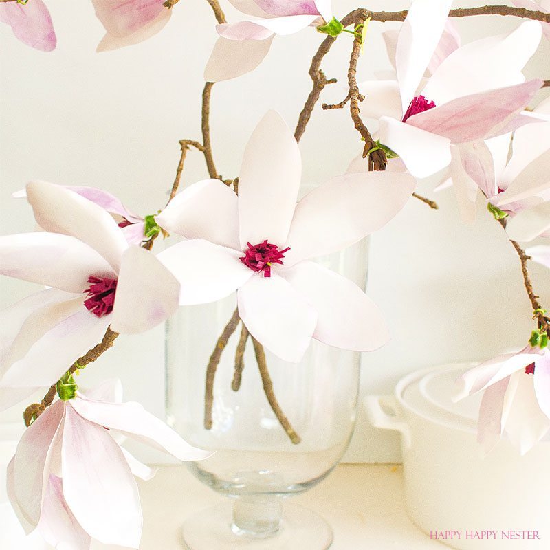 A magnolia paper flower tutorial you won't want to miss. I made this flower out of watercolor flower petals and added them to a tree branch, and you have lifelike flowers that you can make from paper. #DIY | #paperflowers | #crafts | #fauxflowers