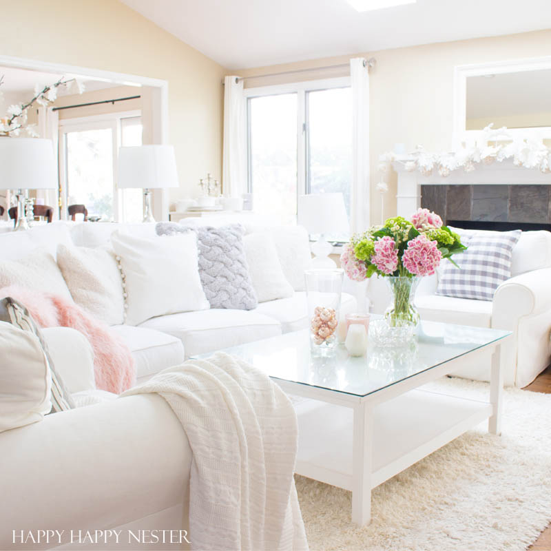 Decorating with pink is easy. Pink is getting a new look, and you should add some splashes in your home. I have two versions that introduce spring into my living room. I have some easy tips on quickly adding a few accents to your decor. Diy | decorating | blush | pink | millennials | trends