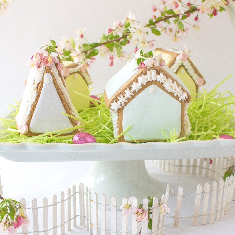 These adorable Easter Houses are perfect for spring. Make them from the mini-gingerbread kit, and you'll love this easy project. Place them on a cake stand and use them on your Easter or Spring table. Decorate them with icing and fun candies. You and your family will love this project. #spring #easter #diy #crafts