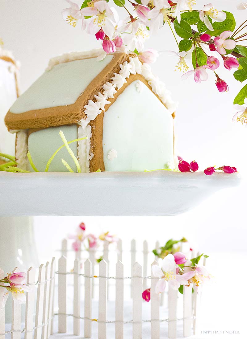 These adorable Easter Houses are perfect for spring. Make them from the mini-gingerbread kit, and you'll love this easy project. Place them on a cake stand and use them on your Easter or Spring table. Decorate them with icing and fun candies. You and your family will love this project. #spring #easter #diy #crafts