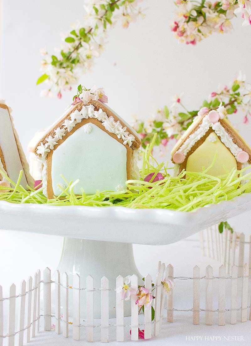 These adorable Easter Houses are perfect for spring. Make them from the mini-gingerbread kit, and you'll love this easy project. Place them on a cake stand and use them on your Easter or Spring table. Decorate them with icing and fun candies. You and your family will love this project. #spring #easter #diy #crafts