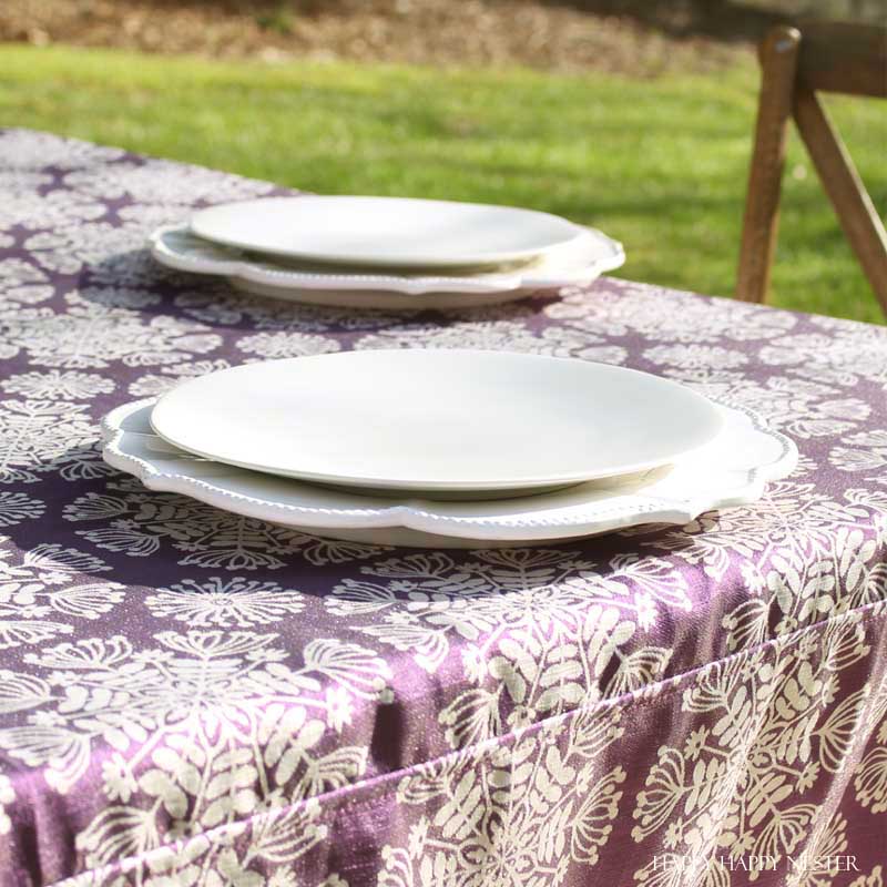 Take your spring table setting outdoors and add some gorgeous flower centerpieces to create a memorable setting. With my step by step way to build your table, you can have a lovely outdoor table ready for entertaining. #diy #tabledecor #tablescape #springdecor #springtable #springtablesetting #flowercenterpieces