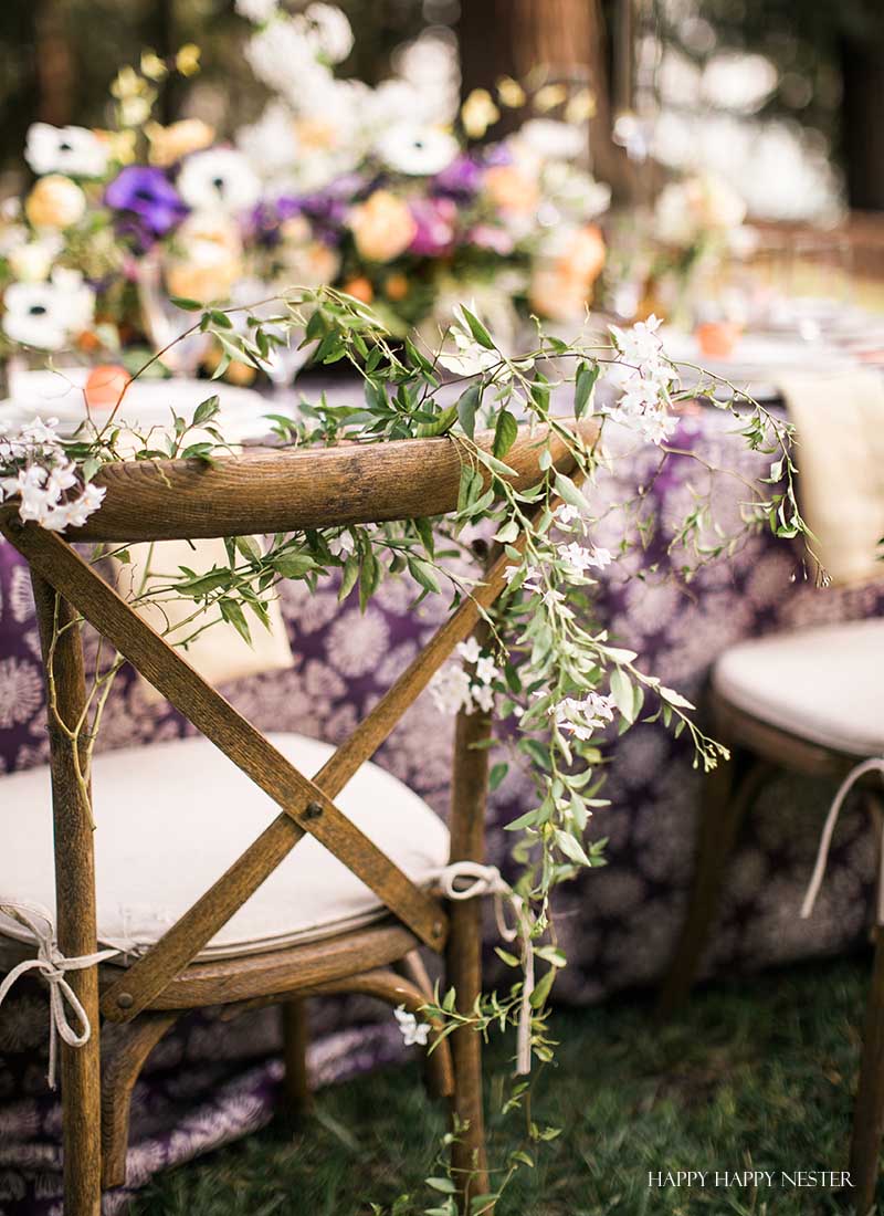 Take your spring table setting outdoors and add some gorgeous flower centerpieces to create a memorable setting. With my step by step way to build your table, you can have a lovely outdoor table ready for entertaining. #diy #tabledecor #tablescape #springdecor #springtable #springtablesetting #flowercenterpieces