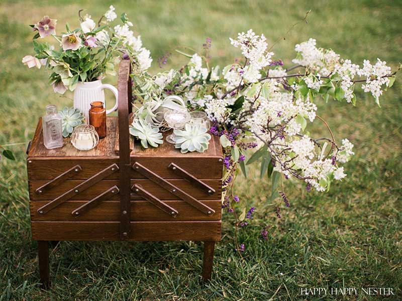 Take your spring table setting outdoors and add some gorgeous flower centerpieces to create a memorable setting. With my step by step way to build your table, you can have a lovely outdoor table ready for entertaining. #diy #tabledecor #tablescape #springdecor #springtable #springtablesetting #flowercenterpieces