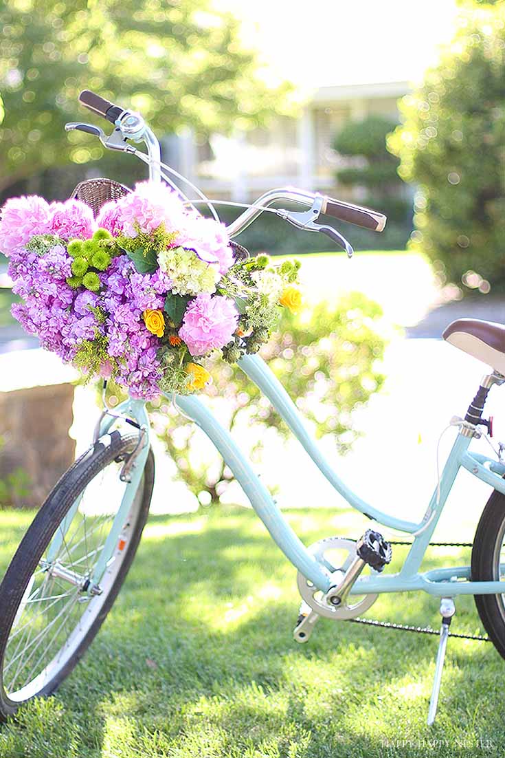 aqua cruiser bike with basket of flowers