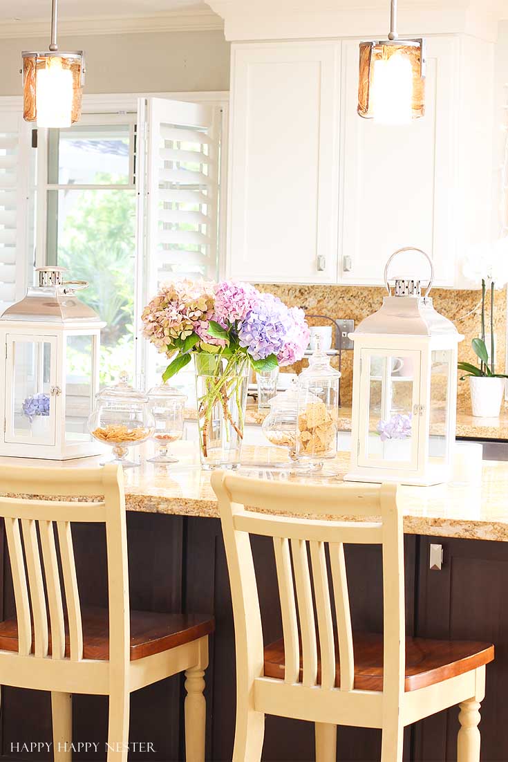 yellow kitchen island with flowers