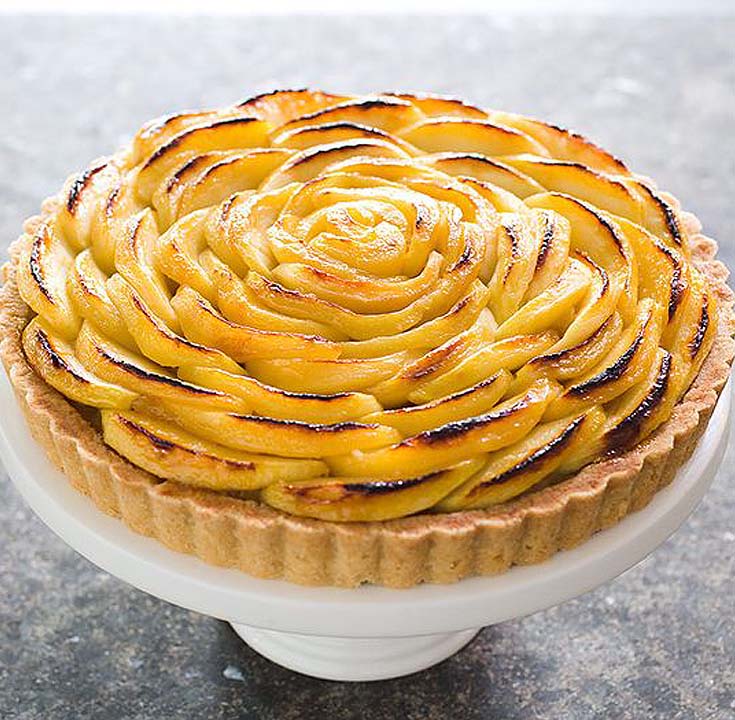 apple tart on a white cakestand