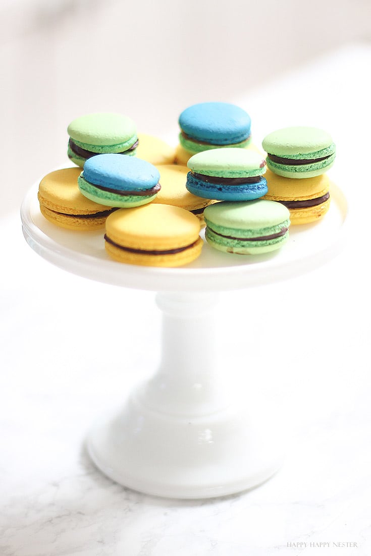 macaron cookies on a white cake stand