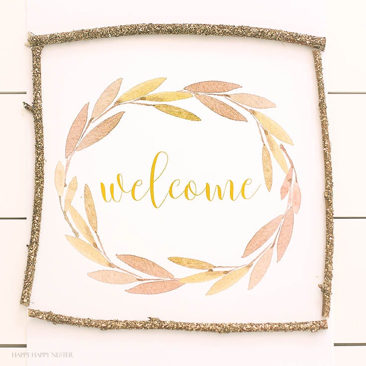 Farmhouse style welcome sign on white table