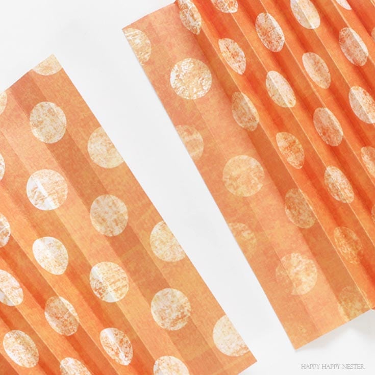 orange paper folded in accordion style