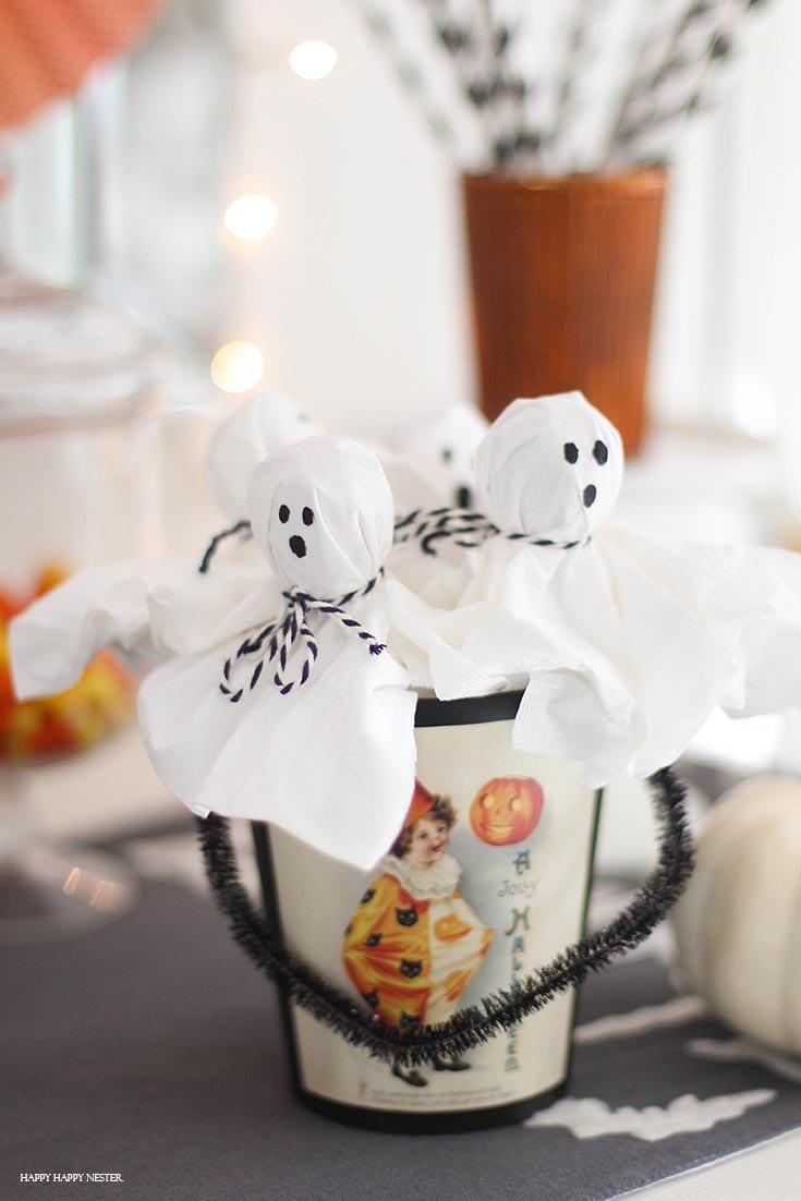 cute lollipop ghosts in a Halloween container