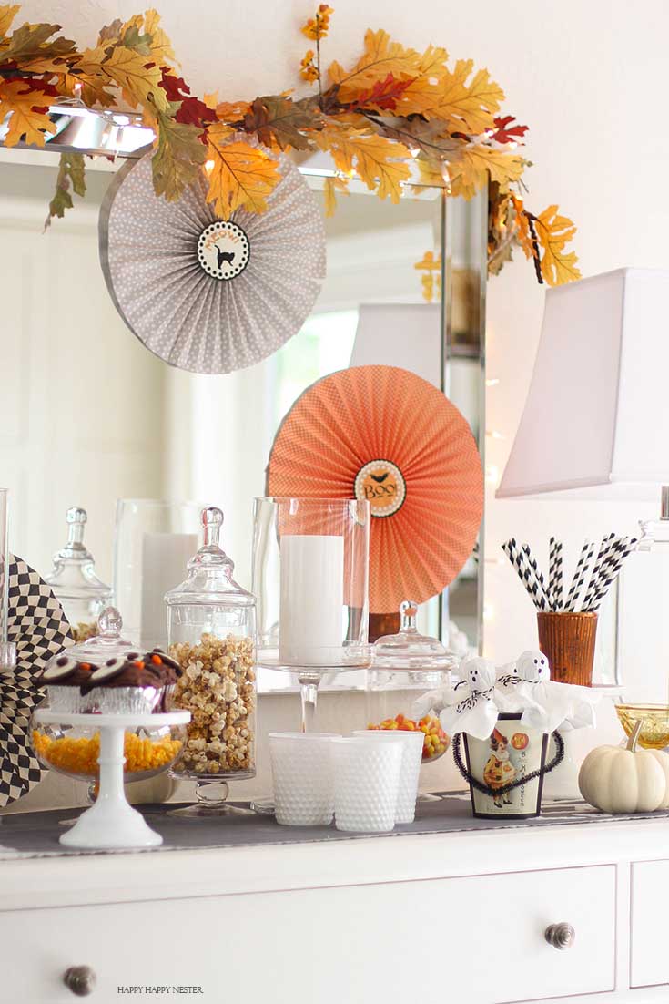 paper pinwheels with a buffet filled with Halloween candy