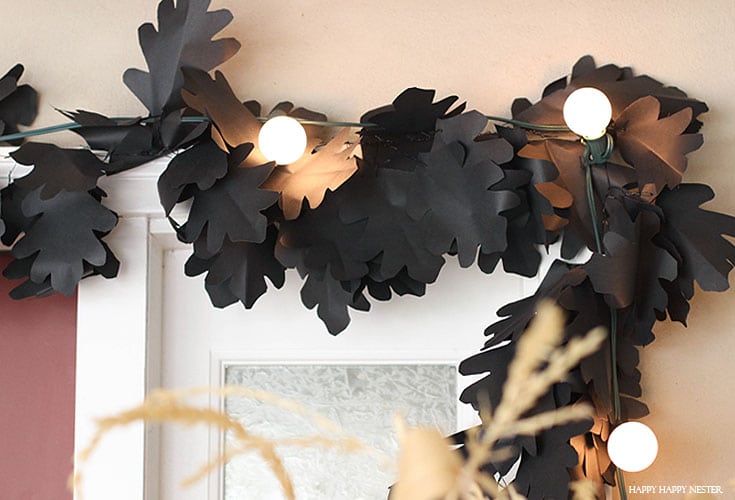 black leaf garland with white lights