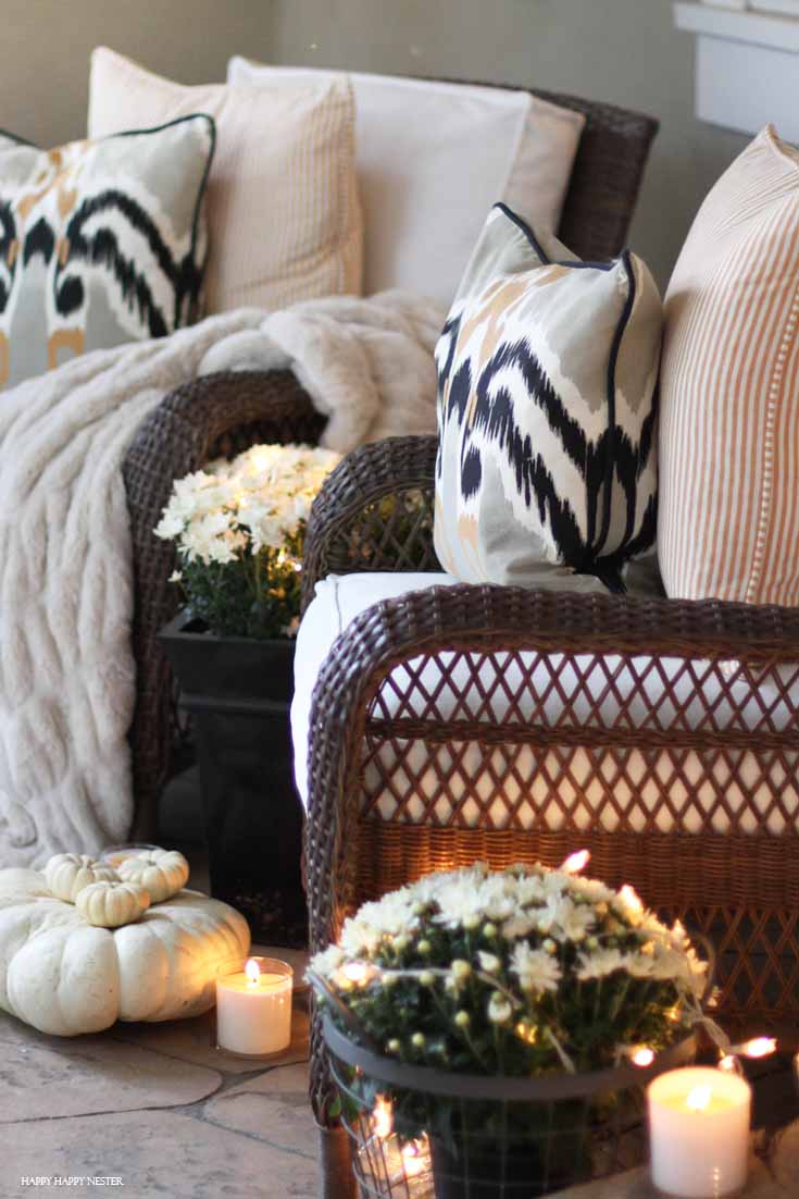 front porch with two chairs and candles lit