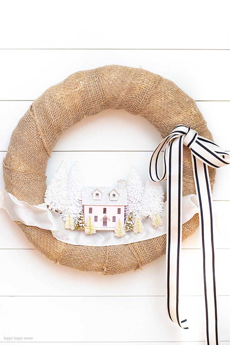 This handmade Putz house or paper house is perfect in this village wreath. Check out this wonderful collection of miniature paper houses. 