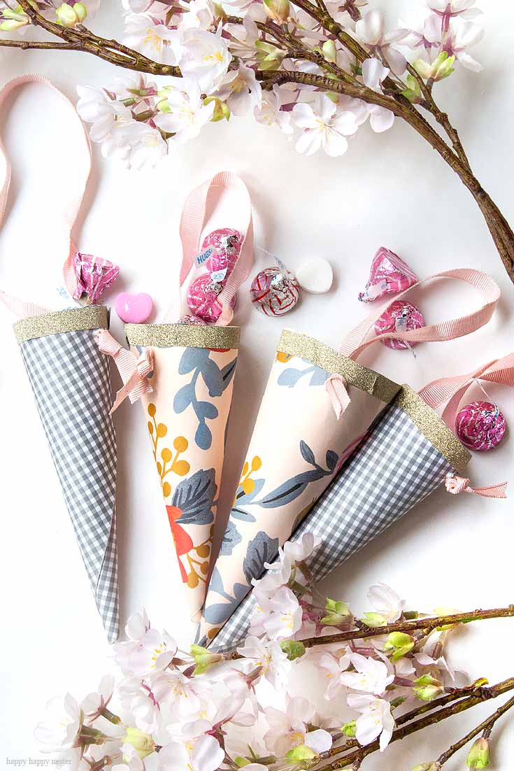 How to Make Easy Paper Cones for Treats is a tutorial that you'll want to check out. These paper cones make great treats, wedding favors, and kid's party favors. Make them out of your favorite rectangular craft or wrapping paper. Paper Cones | Party Favors | Wedding Favors | Treat Holders | Wedding Decor DIY | Crafts