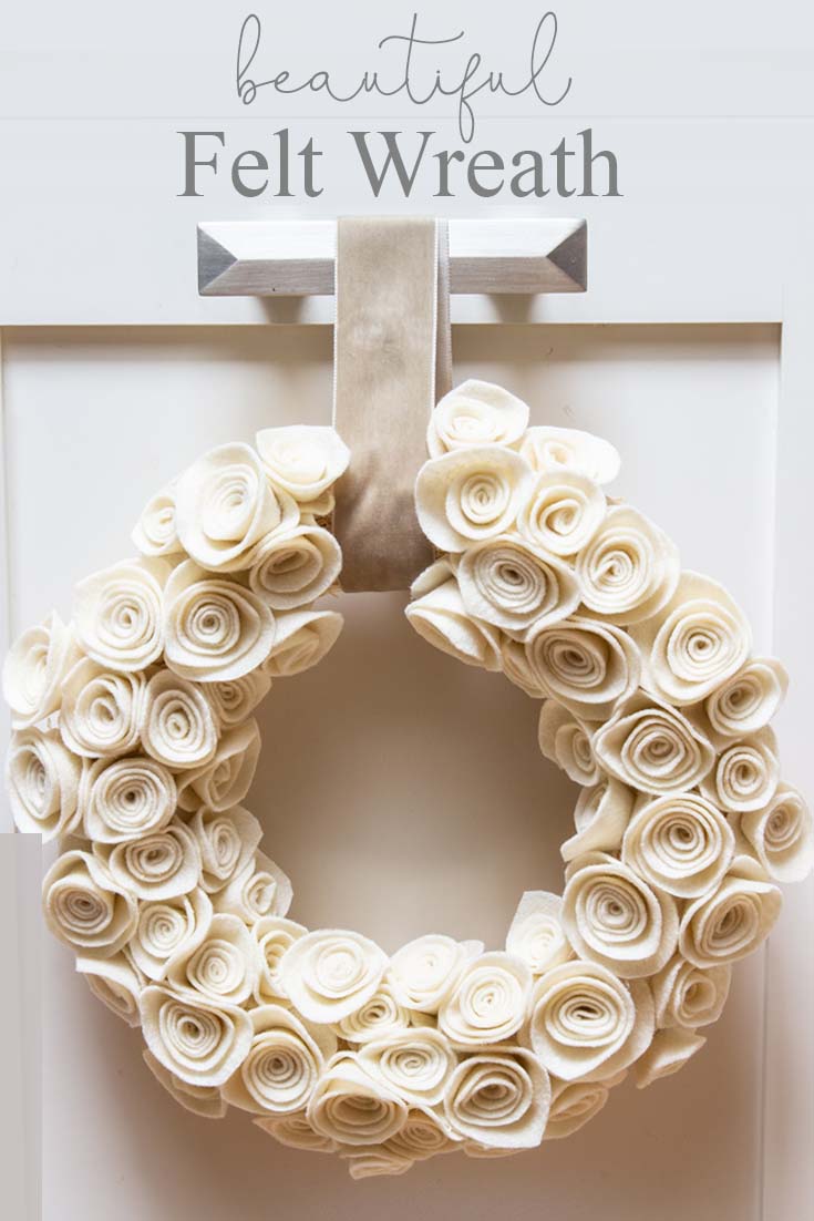 This Rosette Felt Wreath Tutorial makes a beautiful wreath. You'll find it easy to make. The neutral color will go with any decor, and it can be displayed all year long. So, make sure to create this felt flower wreath with these cute felt rosettes.