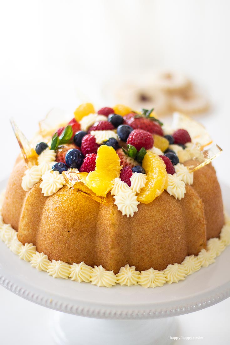 The Savarin Cake with fresh fruit. Here is a Yeast Cake Recipe that is soaked thoroughly in an Orange Grand Marnier syrup. This cake is topped with a Sabayon cream frosting and fresh fruit. This unique yeast cake is a bit rustic and very gourmet in taste. It is an impressive cake. Cake | French Cake | Baking | Gourmet Desserts | European Cake