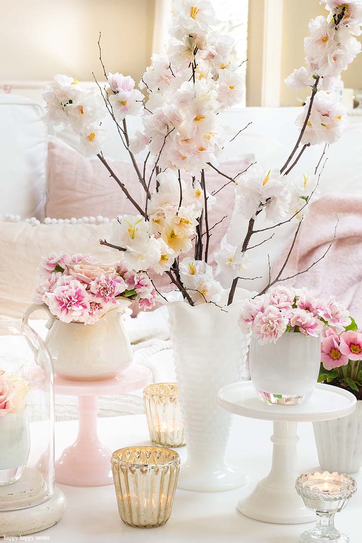 Find out how to introduce a few easy elements when creating a new look. The best way to say goodbye to winter is a Pretty Pink Spring Home Tour. I love how happy the color pink is, and it is so pretty in our living room, entry and dining room. Adding fresh flowers brightens a home and welcomes family and friends with a warm embrace. #decorating #springdecor #springtour #pinkdecor #hometour