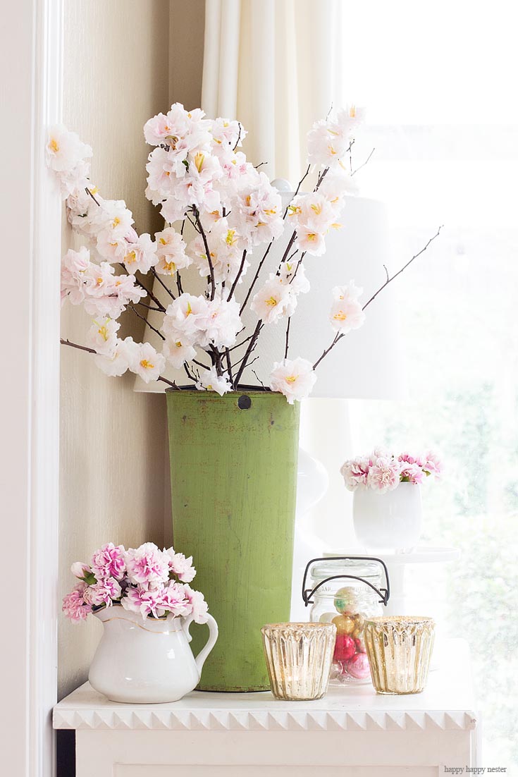 Find some inspiration with flowers for this spring. The best way to say goodbye to winter is a Pretty Pink Spring Home Tour. I love how happy the color pink is, and it is so pretty in our living room, entry and dining room. Adding fresh flowers brightens a home and welcomes family and friends with a warm embrace. #decorating #springdecor #springtour #pinkdecor #hometour