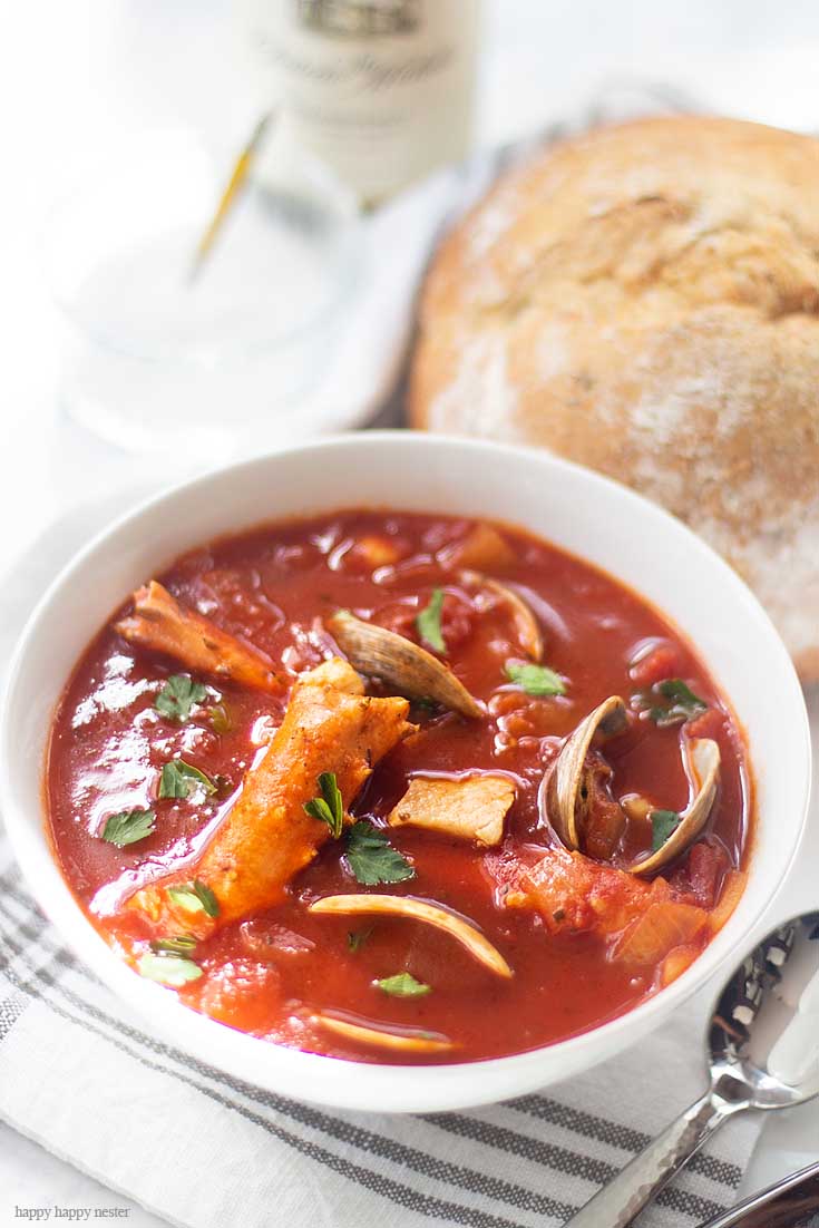 Add any seafood to this dish and you have a tasty soup. Our family favorite Yummy Seafood Stew Recipe is the best San Francisco style Cioppino. Make this the evening before so all the flavors are their best. This is the best Cioppino recipe since it includes wine and sugar to balance and mellow the acid from the tomatoes. #cioppino #italiandinner #soup #fishstew