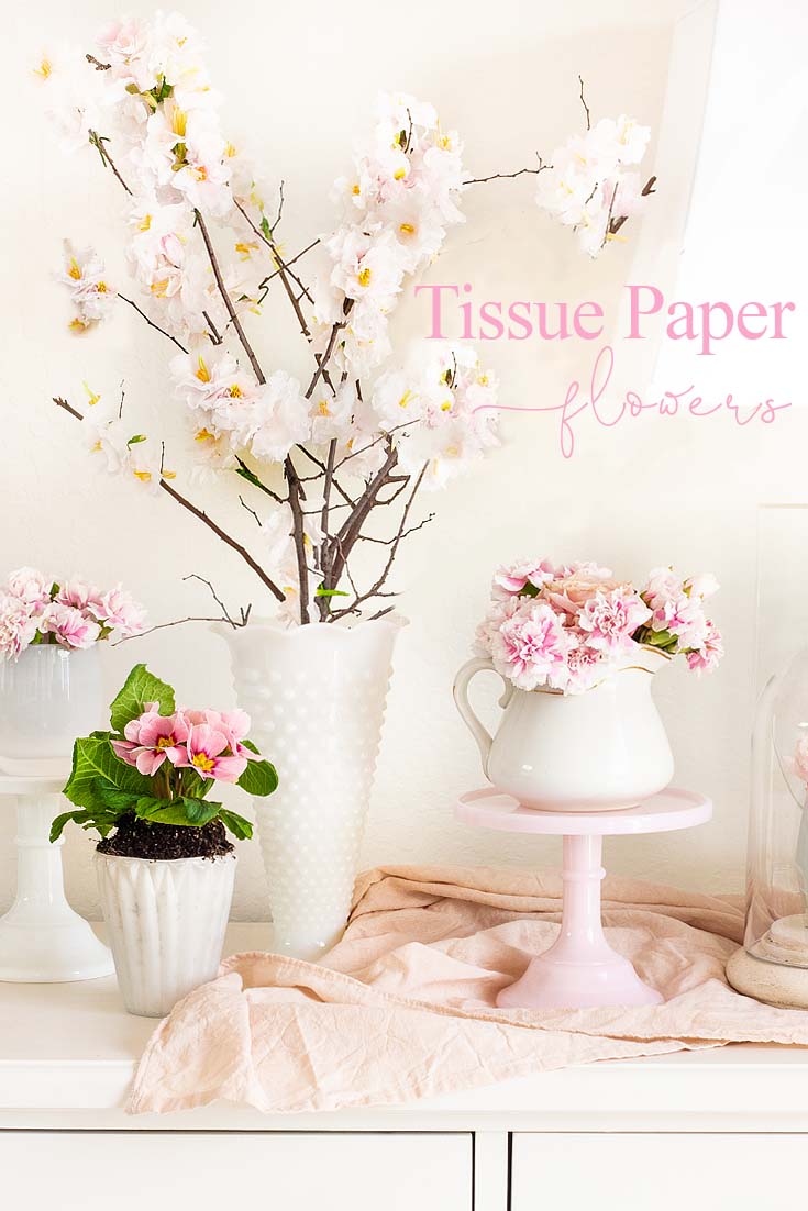 This Tissue Paper Flowers Tutorial creates realistic cherry blossoms. The flowers attach to a real tree branch, and they look amazing. This project has full instructions and you can make them from home. These paper flowers are great for home as well as for weddings. #paperflowers #crafts #papercherryblossoms #weddings