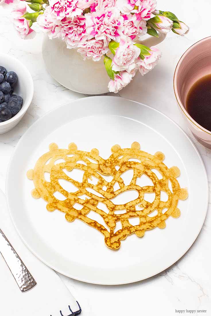 These are seriously the easiest Heart-Shaped Pancakes to make. And if you need some ideas for a Valentine's Day breakfast try making them. Inspired by the lace pancakes on The Great British Baking Show I made them. Not only are they cute, but they also taste yummy. Valentine's Day | Heart Pancakes | Lace Pancakes