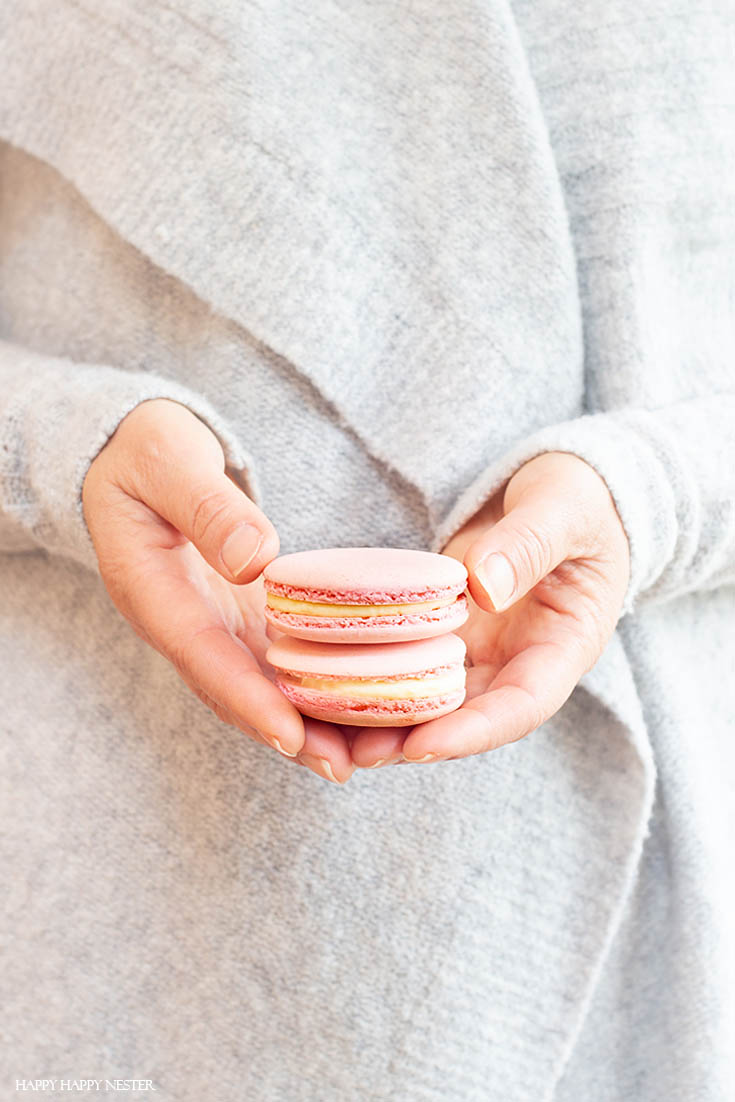 This Italian Meringue Macaron Cookie Bakes Perfect Every Time!I have been obsessed with finding The Best Basic French Macaron Recipe for what feels like an eternity! I'm happy to say that I mastered baking them. This yummy recipe combines the meringue cookie with a buttery French sabayon filling. #macaron #cookie #frenchmacaron #meringue #italianmeringue #baking #bestcookie #bake