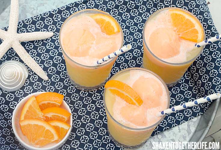 Tropical Orange Sherbet Punch. Here are 10 Non-Alcohol Summer Drinks that you'll love. Need some recipes this summer, well, we have you covered if you need slushies, teas, fruit drinks and more. These bloggers have tested them, and these are their favorites. #drinks #summerdrinks #cocktail #drinkrecipes #recipes #happyhour #weddings #weddingdrinks