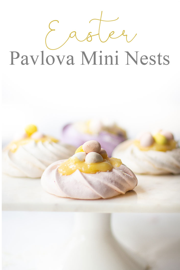 This Pavlova Recipe is so easy and the Mini Nests are so adorable. They are perfect for Easter, a spring dessert or year-round treat. Use different food colors to create cute fresh nests. Top the nests with lemon curd, whip cream, and Easter eggs. #baking #easter #desserts #easterdesserts #meringue #pavlova #lemoncurd