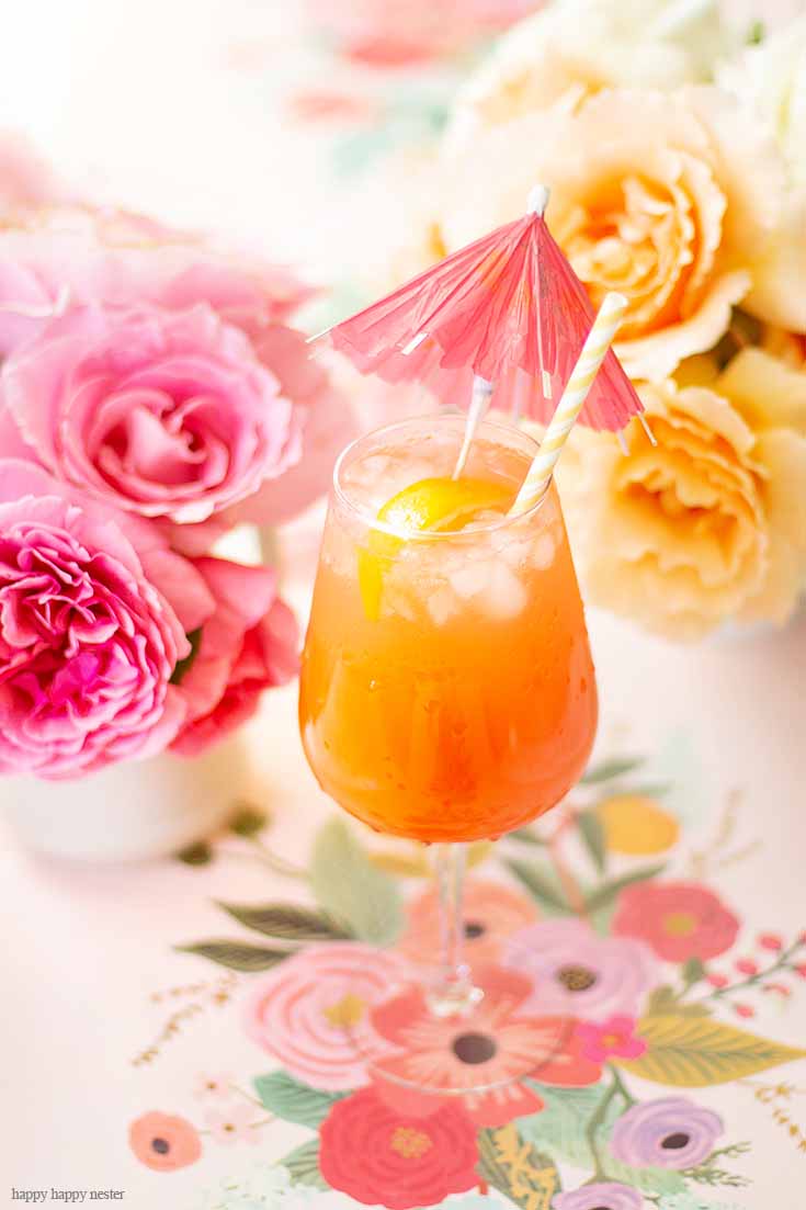 This wonderful simple punch recipe for Mother's Day is good all year round. This an easy recipe and only requires a few ingredients a few minutes to make. Add rum or make it an alcohol-free drink. I believe this cocktail is called a Planter's Punch that is refreshing and yummy. #cocktails #mocktails #drinks #drinkrecipes #recipes #summerdrinks #fruitdrinks