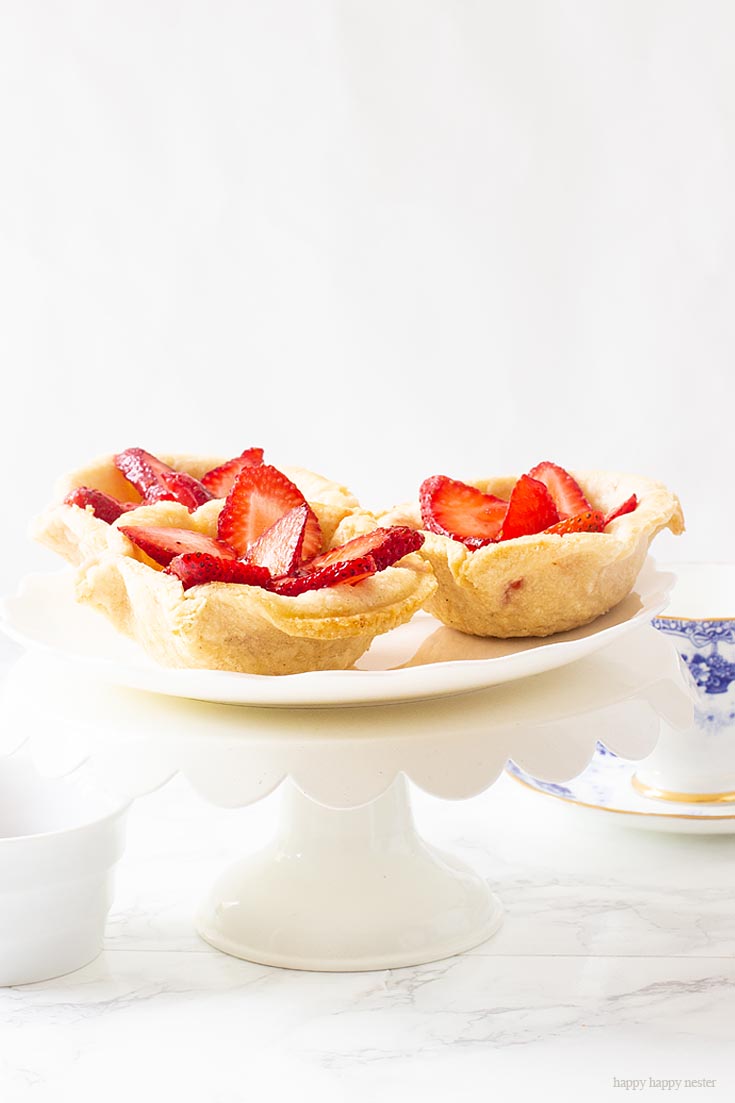 This Creamy Mini Strawberry Tart Recipe is such a delicious gourmet pastry. The French butter cream filling is to die for. #baking #recipe #strawberry