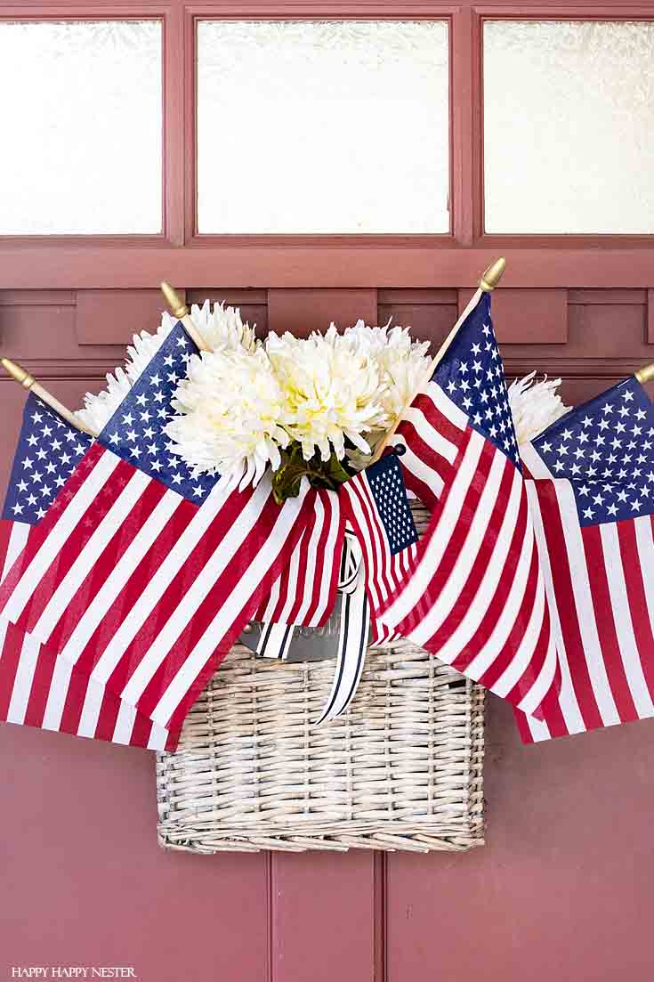 This festive flag front door is perfect for the 4th of July! Take a little tour of our holiday porch. #summerdecor #4thofjuly #holidaydecor