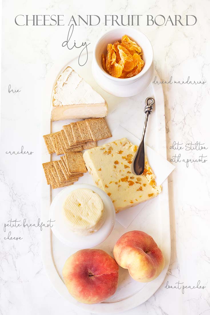 Use just some simple elements like three chesses and a variety of fruit create a yummy board. #appetizers #entertaining #cheeseboards #parties #recipes #chacuterieboards
