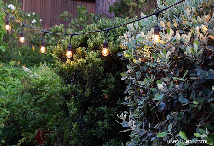 This is a thorough tutorial on how to hand the outdoor vintage Edison lights in a cement hole. #vintageoutdoorlights #patio #outdoorlights